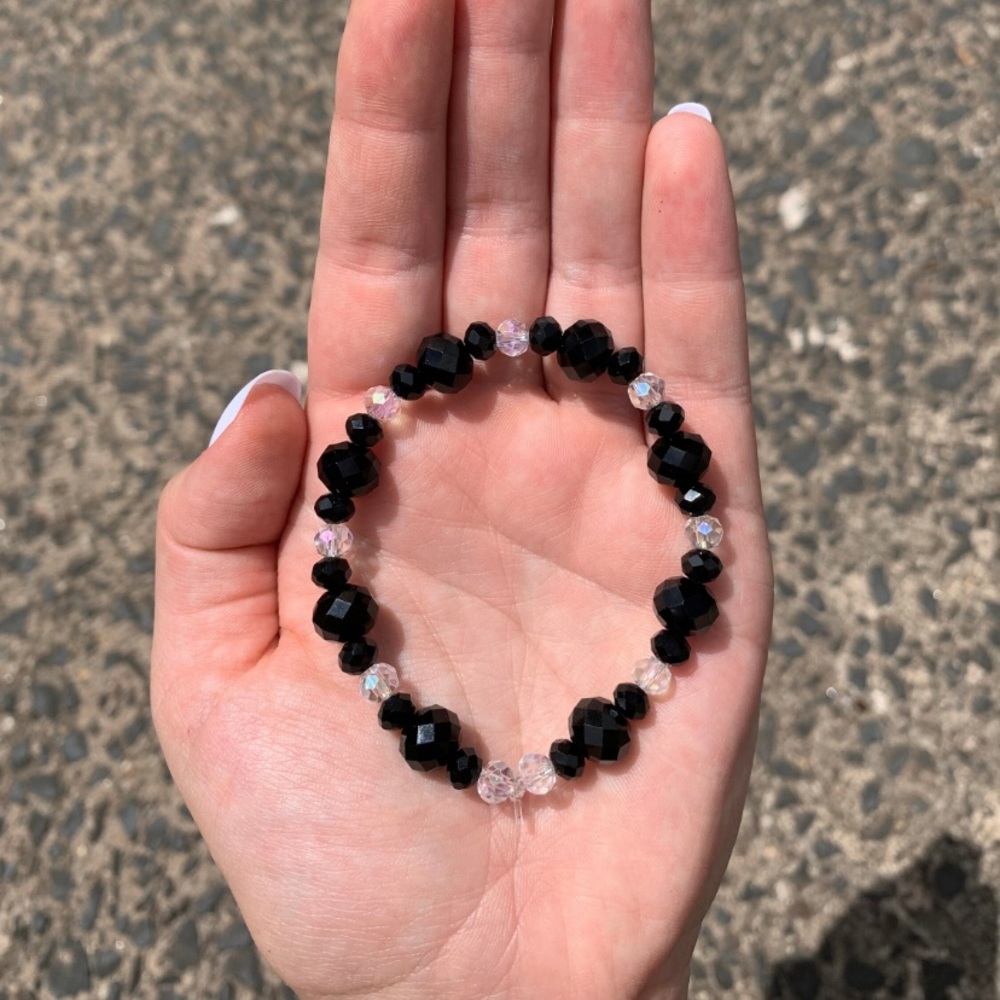 NWOT black and clear crystal beaded elastic bracelet.